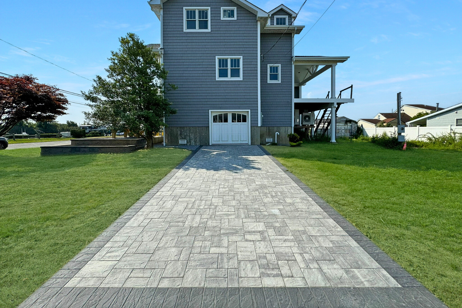 Stamped border paver driveway