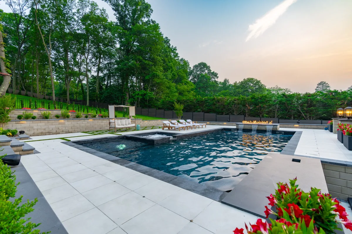 Gunite pool with paver decking and landscaping