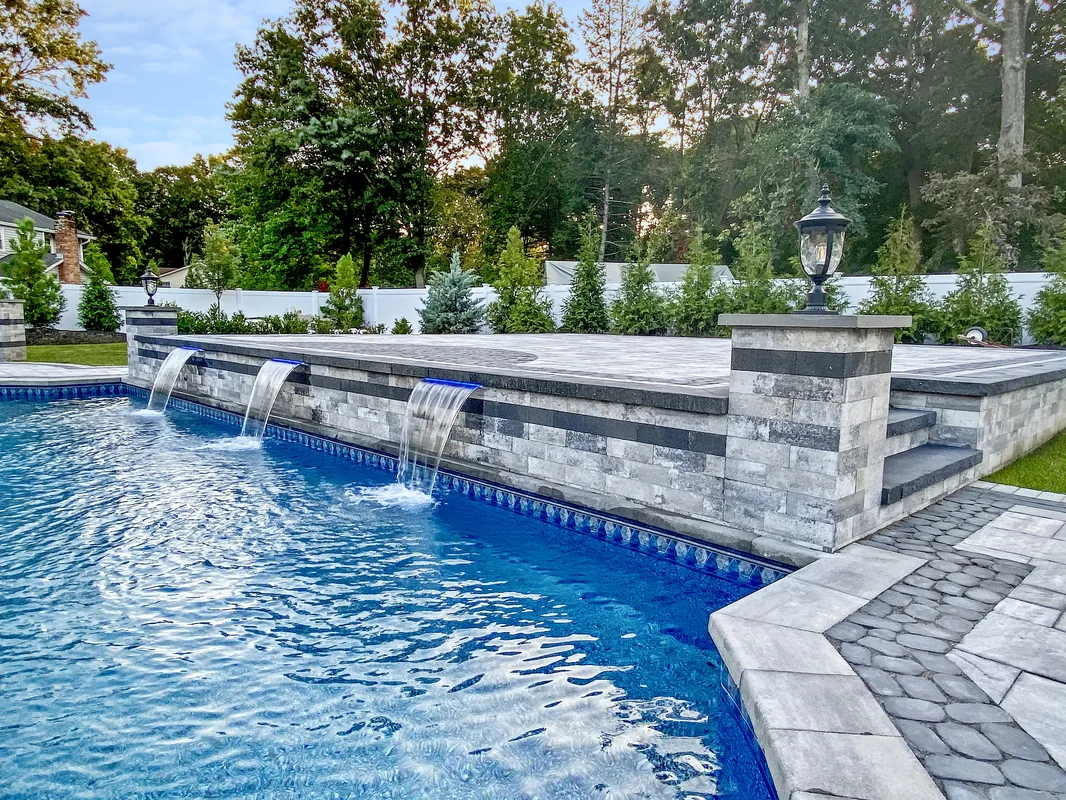 Custom vinyl pool by Flawless Masonry — Long Island backyard installation