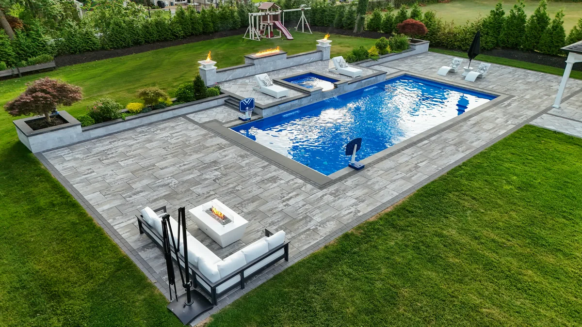 Vinyl liner pool with decking and landscaping — Suffolk County