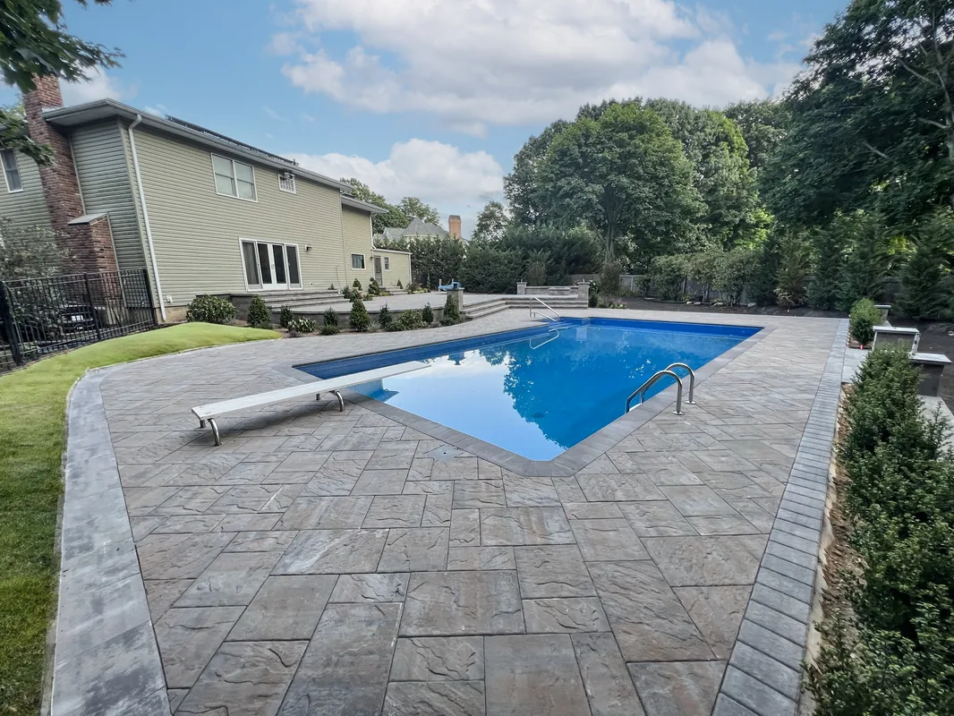 Vinyl pool with pergola and outdoor living space