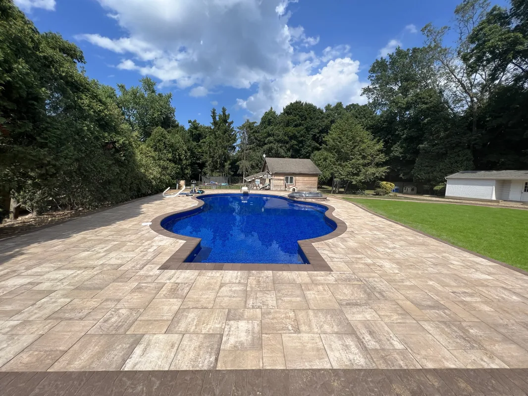 Flawless Masonry vinyl pool — backyard transformation