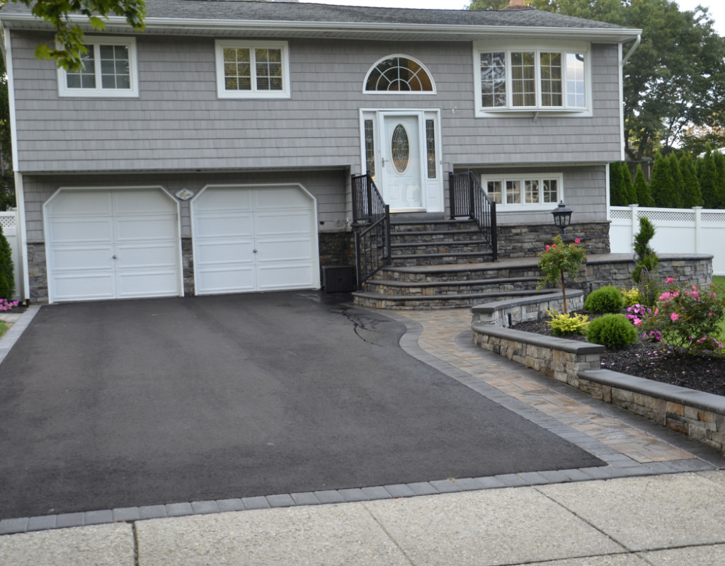 Paved driveway with stone walkway to the front door