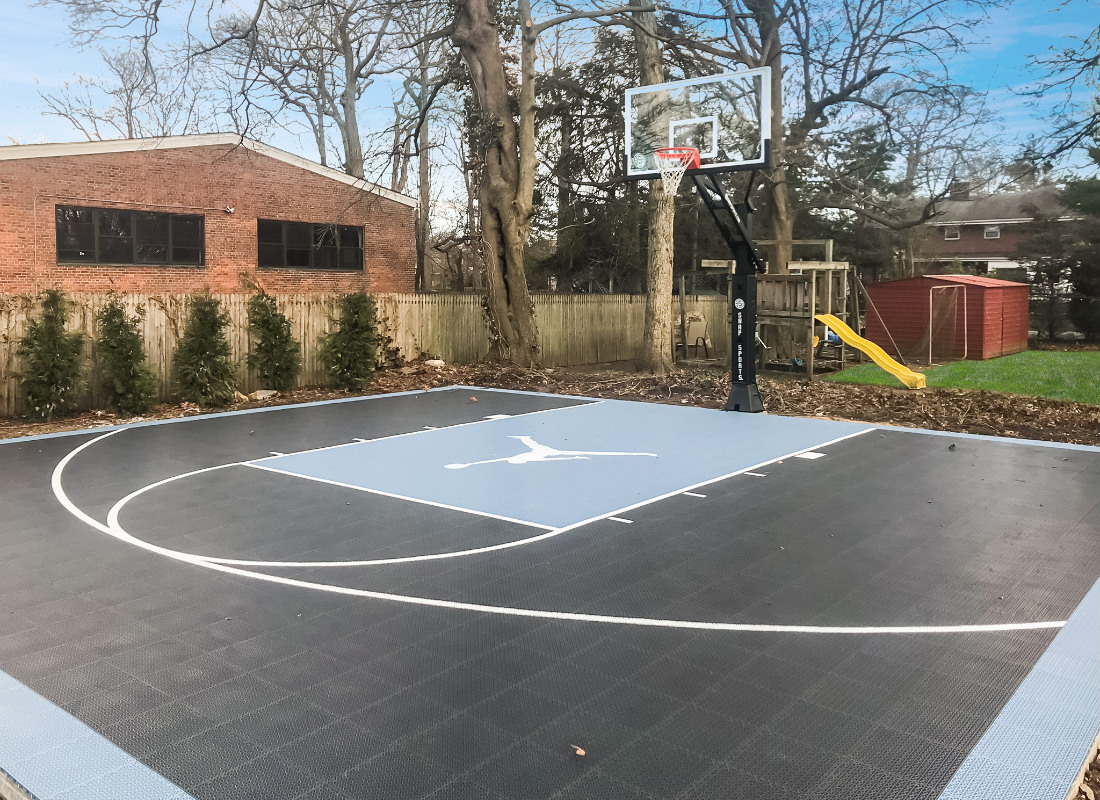 Half basketball court with the Air Jordan logo in the court