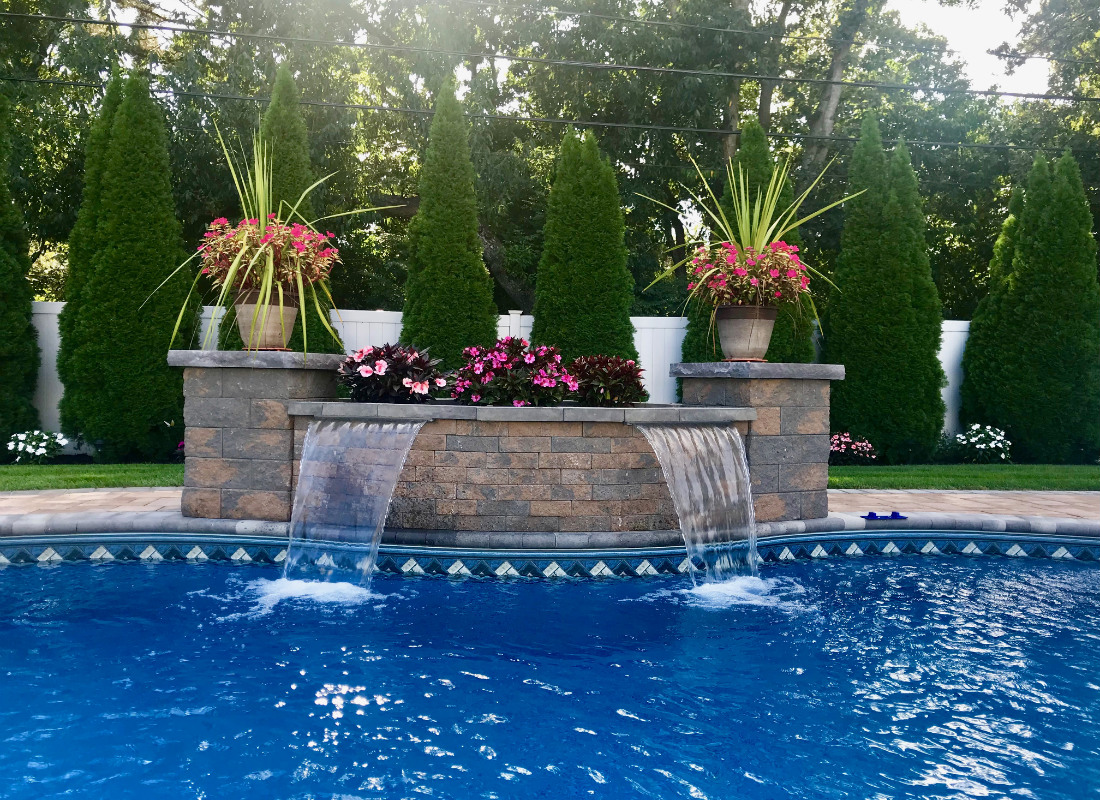 Waterfall from brickwork into pool