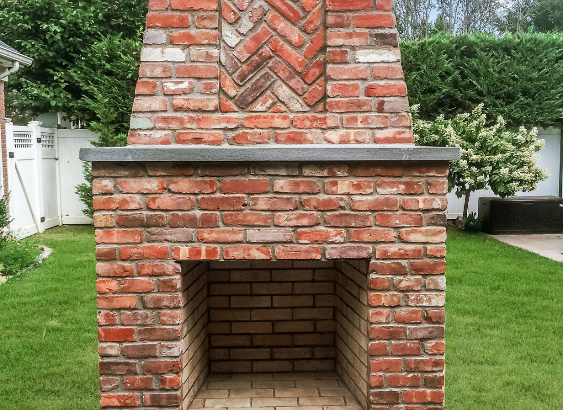 Red brick chimney for outdoor fireplace