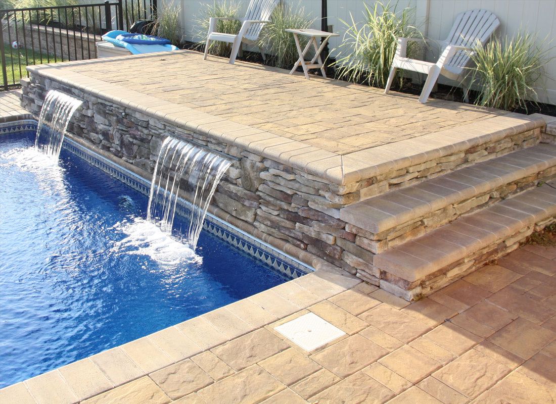 A renovated swimming pool showcasing energy-efficient features and safety enhancements.